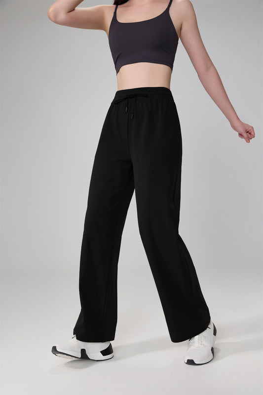 Pantalón deportivo negro de pierna amplia